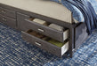 Caitbrook Queen Storage Bed with 8 Drawers with Dresser and Chest Huntsville Furniture Outlet