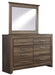 Juararo King Panel Bed with Mirrored Dresser, Chest and Nightstand Huntsville Furniture Outlet
